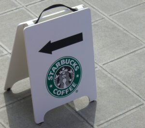 Starbucks sign with arrow